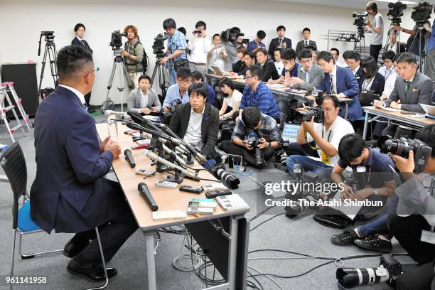 Yasutoshi Okuno, father of injured Kwansei Gakuin University quarter back, speaks during a press conference on May 21, 2018 in Osaka, Japan. The...