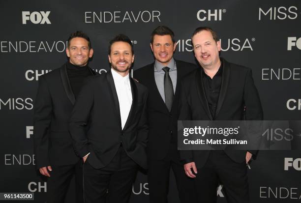 Performers Jeff Timmons, Drew Lachey, Nick Lachey and Justin Jeffre of 98 Degrees pose for pictures on the red carpet at the Shreveport Convention...