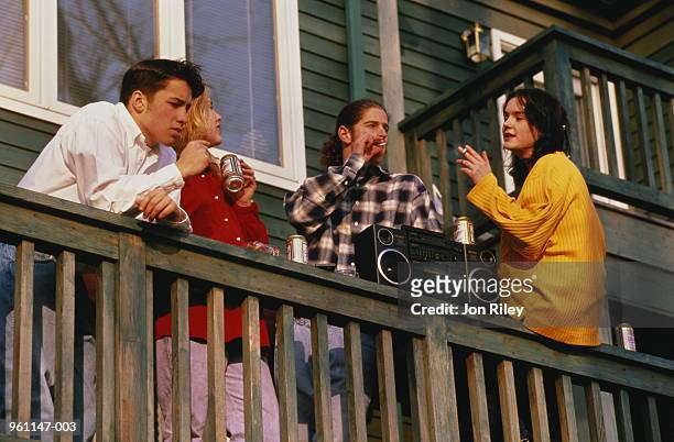 teenagers (16-18) smoking and drinking on balcony - girls boom box stock pictures, royalty-free photos & images