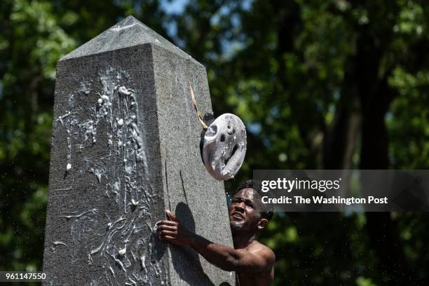 Plebe attempts and fails to throw an upperclassman's hat atop the vegetable shortening covered Herndon Monument obelisk at the US Naval Academy in...