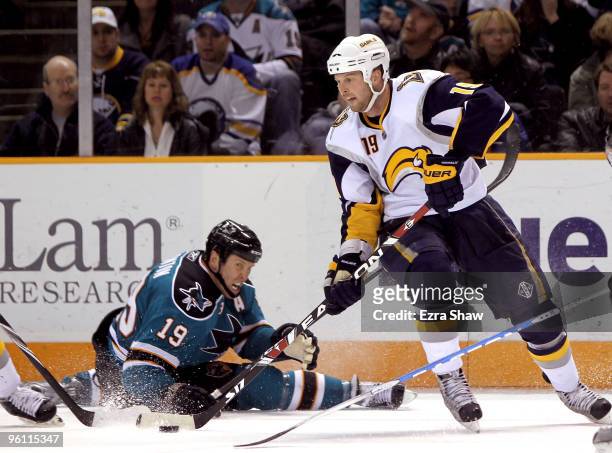Tim Connolly of the Buffalo Sabres and Joe Thornton of the San Jose Sharks go for the puck at HP Pavilion on January 23, 2010 in San Jose, California.