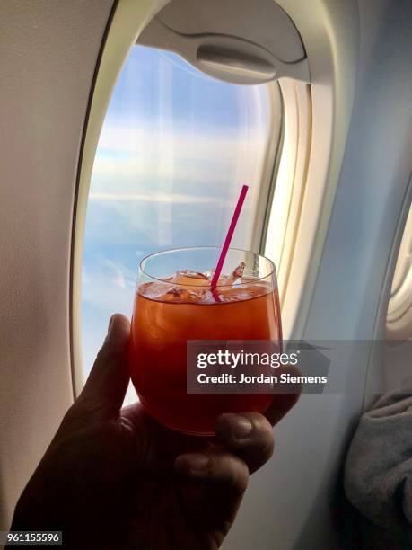 cocktail on an airplane - first class plane stock pictures, royalty-free photos & images