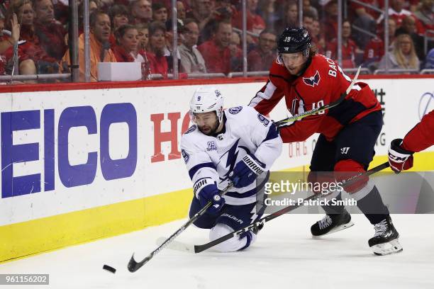 Nicklas Backstrom of the Washington Capitals defends against Tyler Johnson of the Tampa Bay Lightning in the first period of Game Six of the Eastern...