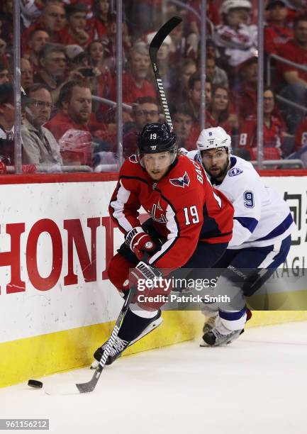 Nicklas Backstrom of the Washington Capitals and Tyler Johnson of the Tampa Bay Lightning vie for the puck in the first period of Game Six of the...