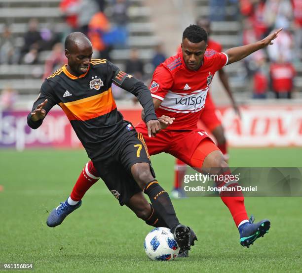 DaMarcus Beasley of Houston Dynamo and Mo Adams of Chicago Fire battle for the ball at Toyota Park on May 20, 2018 in Bridgeview, Illinois. The...