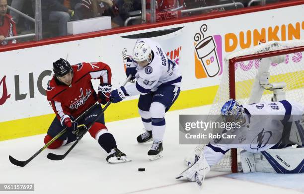 Andrei Vasilevskiy and Yanni Gourde of the Tampa Bay Lightning defend against T.J. Oshie of the Washington Capitals in the first period of Game Six...