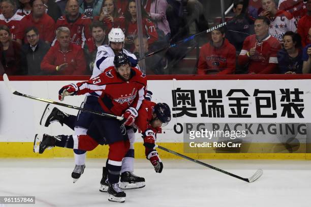 Tom Wilson and Lars Eller of the Washington Capitals skate against Victor Hedman of the Tampa Bay Lightning in the first period of Game Six of the...