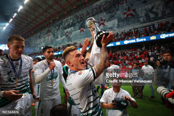Brian Lozano of Santos lifts the trophy to celebrate after the Final second leg match between Toluca and Santos Laguna as part of the Torneo Clausura...