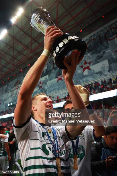Julio Furch of Santos lifts the trophy to celebrate after the Final second leg match between Toluca and Santos Laguna as part of the Torneo Clausura...