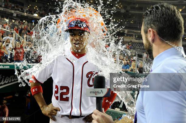 Juan Soto of the Washington Nationals is doused with water after a 10-2 victory against the San Diego Padres at Nationals Park on May 21, 2018 in...