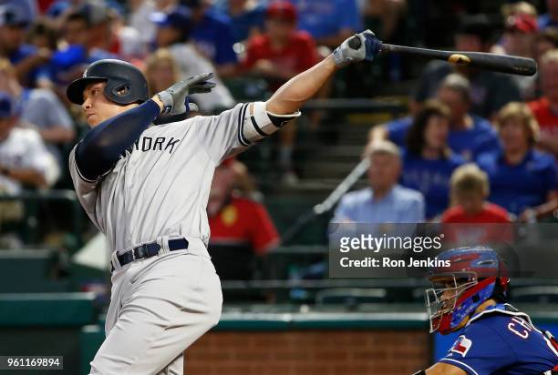 Aaron Judge of the New York Yankees hits a solo home run against the Texas Rangers during the fifth inning at Globe Life Park on May 21, 2018 in...