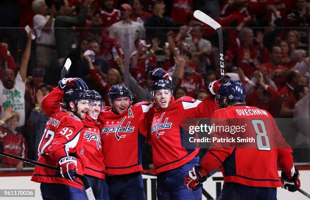 Oshie of the Washington Capitals celebrates his second period goal against the Tampa Bay Lightning with teammates in Game Six of the Eastern...