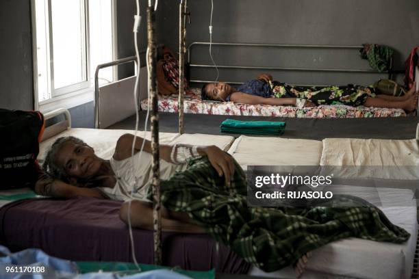 Women rest after a fistula surgery at the fistula treatment centre in Monja Joana Hospital in Ambovombe on March 20, 2018. - Obstetric fistula is one...