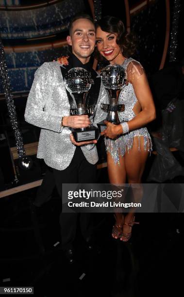 Mirrorball trophy winners figure skater Adam Rippon and dancer/TV personality Jenna Johnson pose at ABC's "Dancing with the Stars: Athletes" Season...
