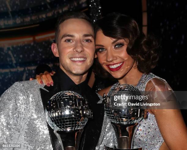 Mirrorball trophy winners figure skater Adam Rippon and dancer/TV personality Jenna Johnson pose at ABC's "Dancing with the Stars: Athletes" Season...