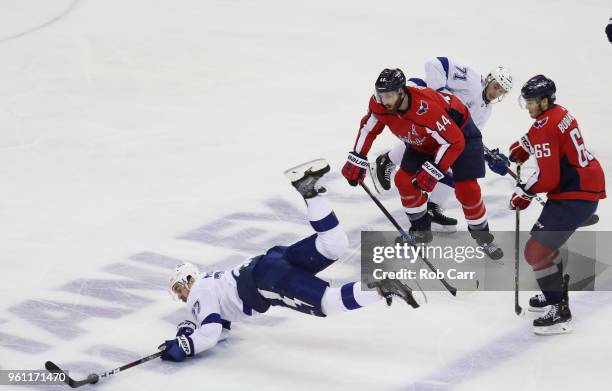 Ryan McDonagh and Anthony Cirelli of the Tampa Bay Lightning skate against Brooks Orpik of the Washington Capitals in the second period of Game Six...