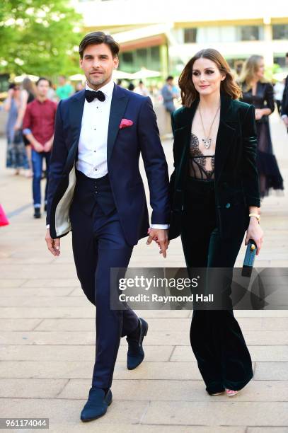 Johannes Huebl and Olivia Palermo are seen walking in Midtown on May 21, 2018 in New York City.