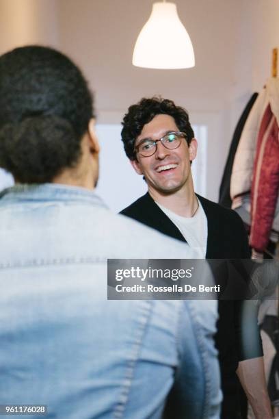 young man arriving at holiday apartment - greeting guests stock pictures, royalty-free photos & images