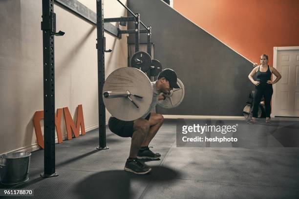 man in gym weightlifting using barbell - heshphoto stock pictures, royalty-free photos & images