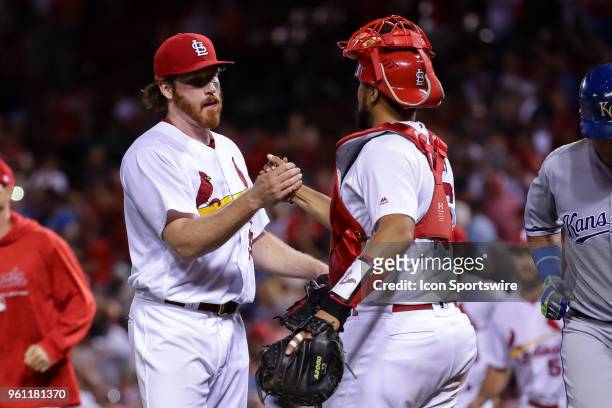St. Louis Cardinals starting pitcher Miles Mikolas, left, celebrates with St. Louis Cardinals catcher Francisco Pena after throwing a complete game...