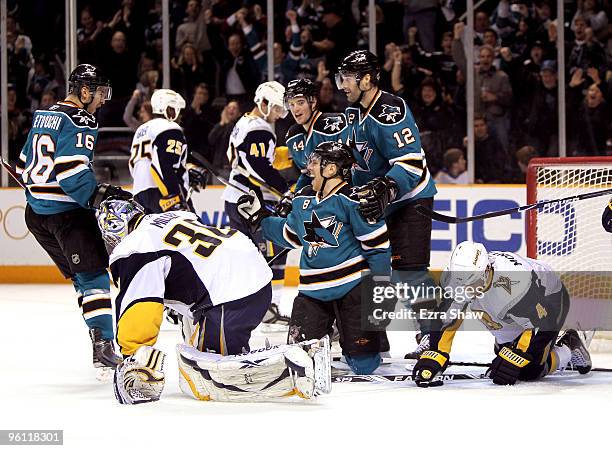 Joe Pavelski of the San Jose Sharks is congratulated by teammates Devin Setoguchi, Patrick Marleau and Marc-Edouard Vlasic after he made a goal on...