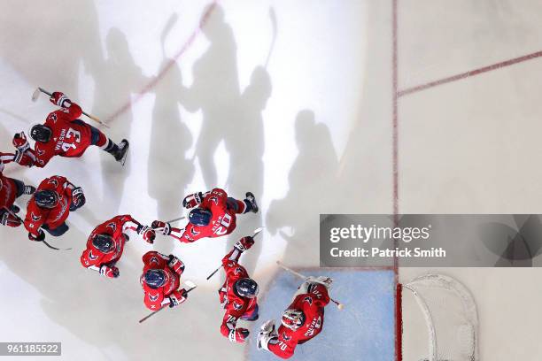 The Washington Capitals celebrate after defeating the Tampa Bay Lightning in Game Six of the Eastern Conference Finals during the 2018 NHL Stanley...