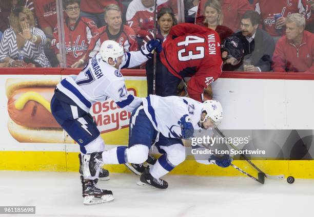 Washington Capitals right wing Tom Wilson jammed into the boards by Tampa Bay Lightning defenseman Ryan McDonagh and center Anthony Cirelli during...