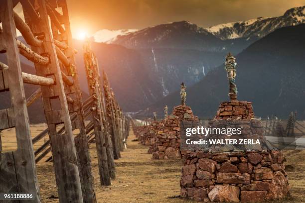 religious structures, mountains in background, shangri-la county, yunnan, china - shangri la county stock pictures, royalty-free photos & images
