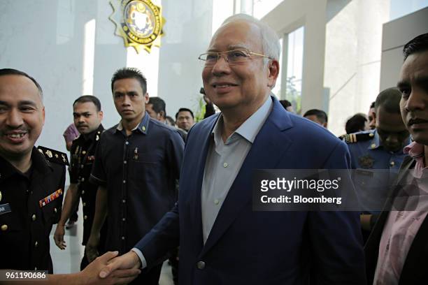 Najib Razak, Malaysia's former prime minister, arrives at the Malaysian Anti-Corruption Commission's headquarters in Putrajaya, Malaysia, on Tuesday,...