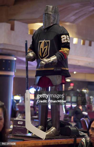 Knight in a gaming pit at Excalibur Hotel & Casino holds a hockey stick and wears a jersey of goaltender Marc-Andre Fleury of the Vegas Golden...