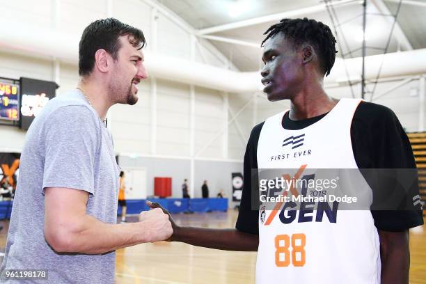 Australian Basketballer Andrew Bogut who will play for the Sydney Kings next NBL season, meets Sydney Kings development squad player Deng Acouth at...