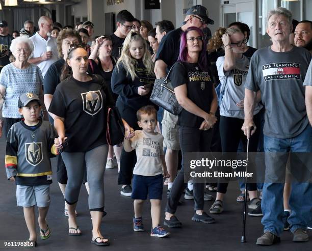 Fans line up to get into the Arsenal retail store at City National Arena to buy Vegas Golden Knights gear the day after the team won the Western...