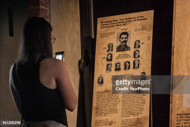 Visitor takes a photo of a Stalin banner in a exhibition of the Gulag History Museum in Moscow, Russia, on 21 May 2018.