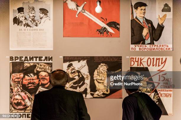 Visitors look soviet propaganda banners of 30´s in a exhibition of the Gulag History Museum in Moscow, Russia, on 21 May 2018.