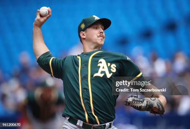 Daniel Mengden of the Oakland Athletics delivers a pitch in the first inning during MLB game action against the Toronto Blue Jays at Rogers Centre on...