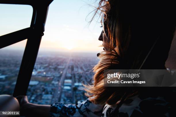 woman in helicopter - helicopter stock-fotos und bilder