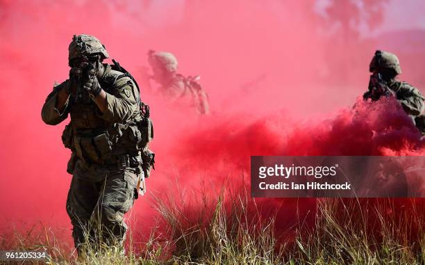 Army soldiers from Apache Company 235 Inf. 25th Infantry Division assault an urban complex during Exercise Southern Jackaroo on May 22, 2018 in...