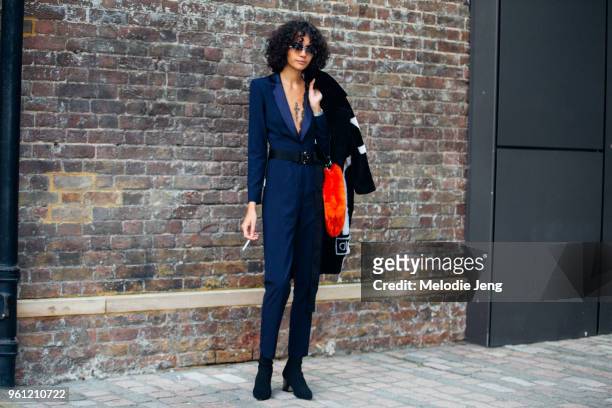 Model Fernanda Oliveira wears sunglasses and a purple jumpsuit during London Fashion Week Spring/Summer 2018 on September 17, 2017 in London, England.