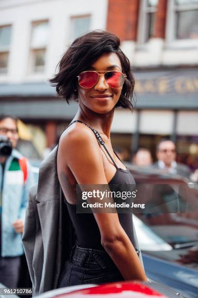 Model Jourdan Dunn wears a London tanktop and red reflective sunglasses during London Fashion Week Spring/Summer 2018 on September 17, 2017 in...