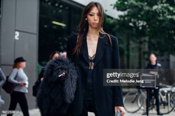 Model Issa Lish wears a black blazer and lace top during London Fashion Week Spring/Summer 2018 on September 17, 2017 in London, England.