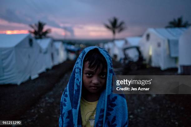 Displaced boy inside the Sarimanok tent city, a temporary shelter, on May 15, 2018 in Marawi, Philippines. With their homes destroyed and their...