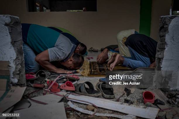 Displaced Marawi residents in a still unfinished mosque in a transition shelter area on May 11, 2018 on the outskirts of Marawi, Philippines. With...