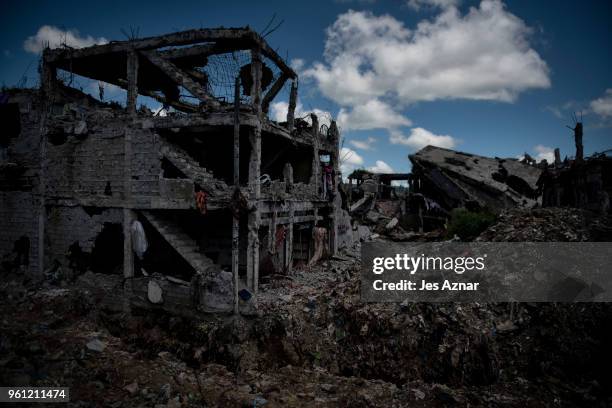 Destroyed buildings and houses fill the landscape inside what used to be the main battle area on May 10, 2018 in Marawi, Philippines. With their...