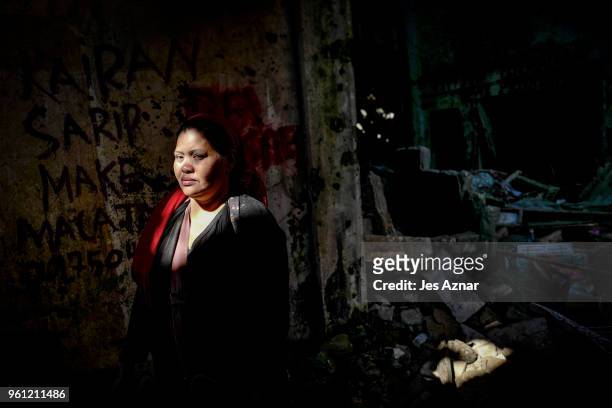 Kairam Sarip standing inside her destroyed shop on May 10, 2018 in Marawi, Philippines. Kairam used to own three houses and a beauty supply shop...
