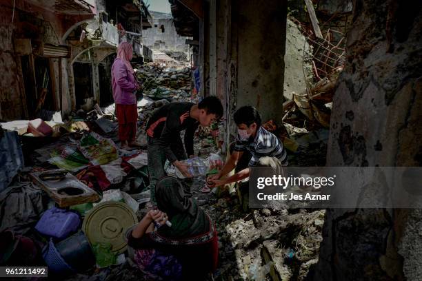 Marawi residents salvage any usable items they can find from what is left of their homes as they were allowed to enter for three days in what used to...