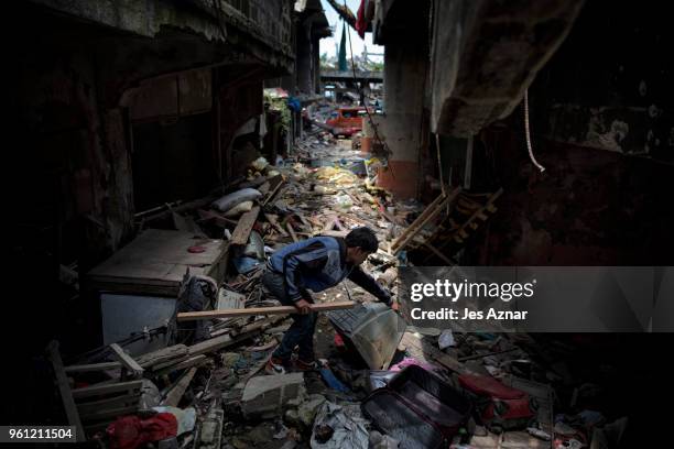 Marawi residents salvage any usable items they can find from what is left of their homes as they were allowed to enter for three days in what used to...