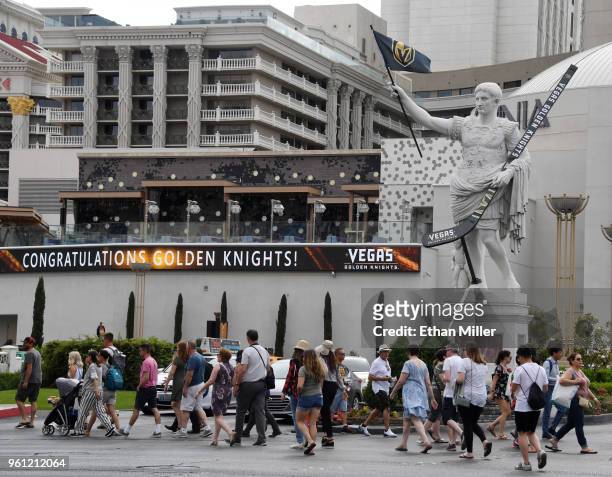 Statue of Julius Caesar in front of Caesars Palace displays an oversized Vegas Golden Knights hockey stick and a flag with the team logo as an...