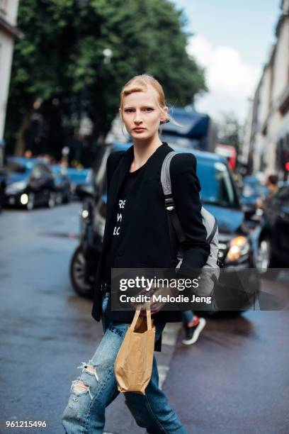 Model Leah Rodl wears a black blazer with accented shoulders during London Fashion Week Spring/Summer 2018 on September 18, 2017 in London, England.