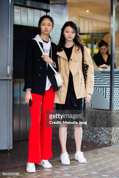 Chinese models Sijia Kang and Cong He after a show during London Fashion Week Spring/Summer 2018 on September 18, 2017 in London, England. Sijia...