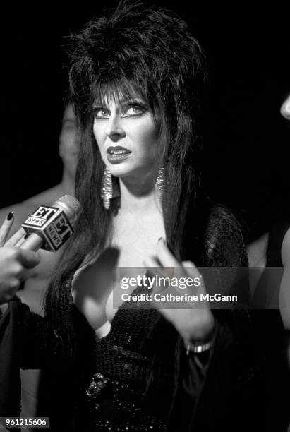 September 1988: American actress Cassandra Peterson, in character as Elvira, Mistress of the Dark at a party in September 1988 in New York City, New...